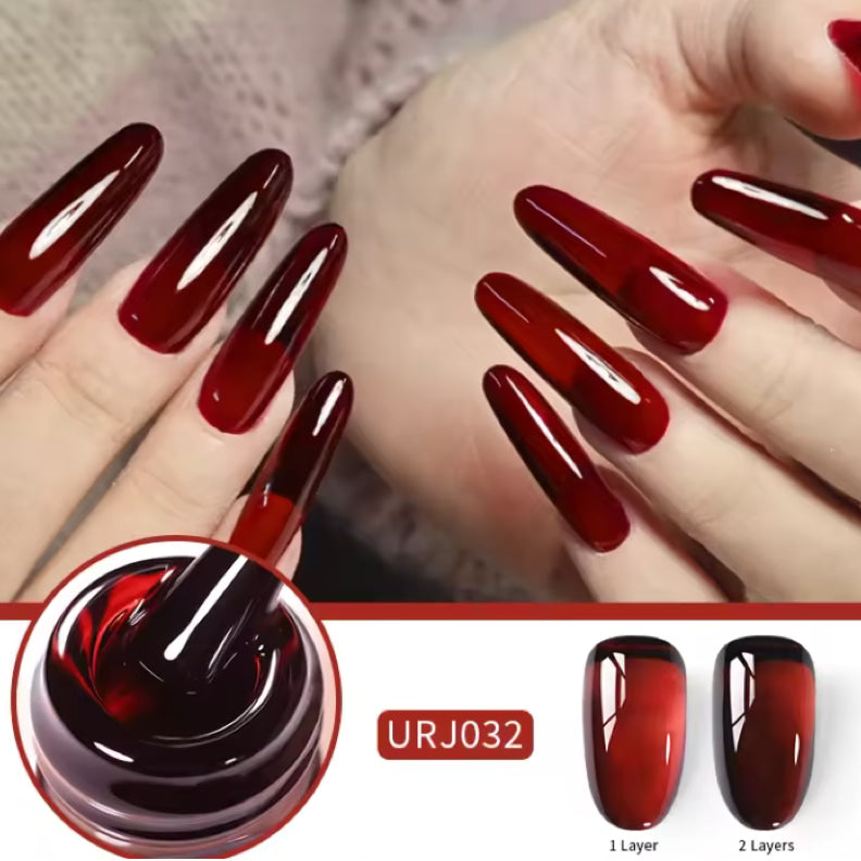 UNS Translucent Cherry Red Nail Gel showing a smooth, shiny jelly consistency in a clear container.