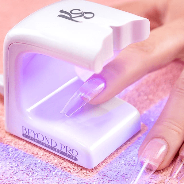 Kiara Sky Beyond Pro Flash Cure LED Lamp for gel nail system, clear view of the compact, professional nail curing device.