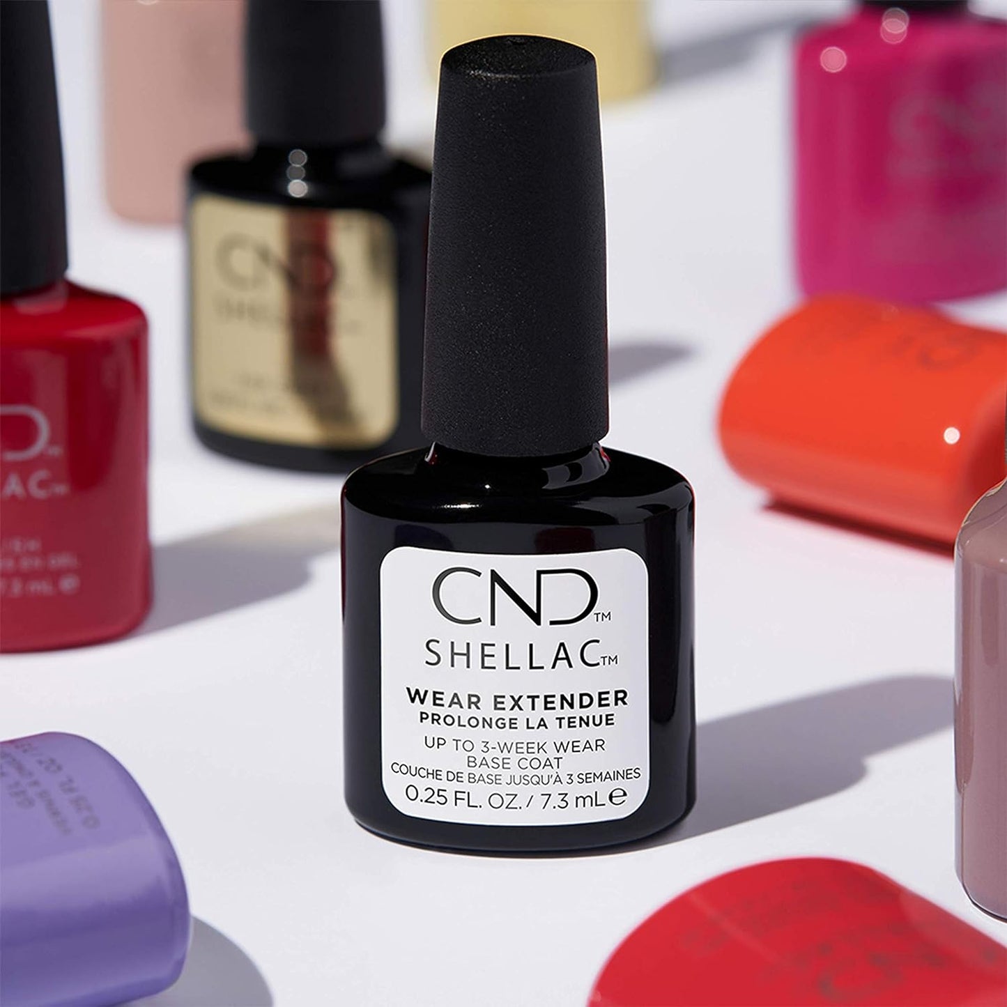 Creative Nail Design Shellac Wear Extender Base Coat for gel nail polish, 0.42 oz, applied on nails for long-lasting shine.