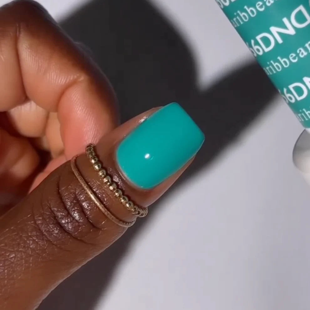 DND Daisy Gel Duo Caribbean Sea #666 featuring vibrant blue gel nail polish and lacquer in a sleek bottle.
