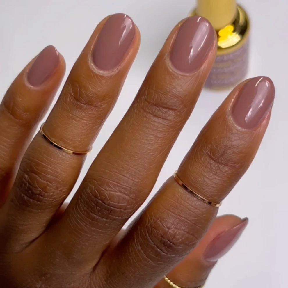 DND DC Gel Duo Naked Tan #074 gel nail polish and lacquer swatch showing glossy, natural tan finish on nails