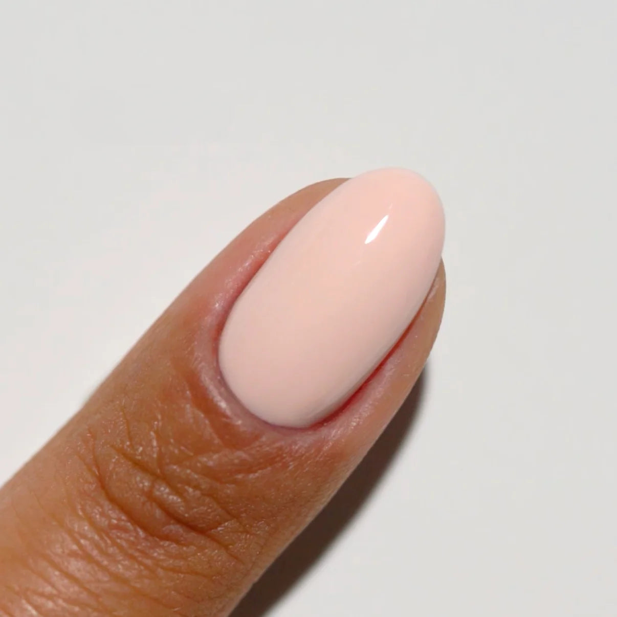 Swatch of DND Diva Duo Gel & Polish French Girl 061 showcasing a classic French manicure with nude base and white tips.