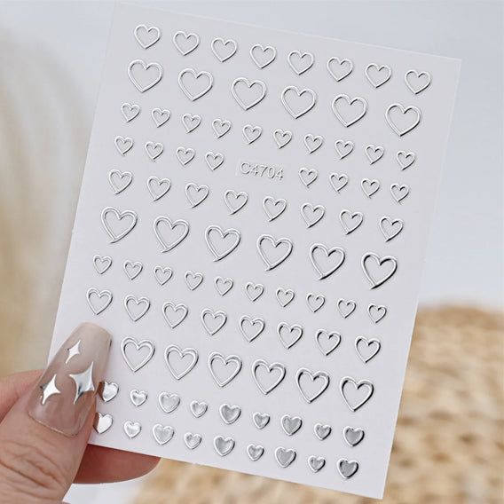 Silver 3D mix shape nail art decoration stickers by UNS for creative nail designs, featuring five-piece nail art sticker set.