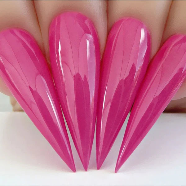 Kiara Sky Dip Powder Head Over Heels #D525 gel nail polish in a clear, glossy finish with heels in the background.