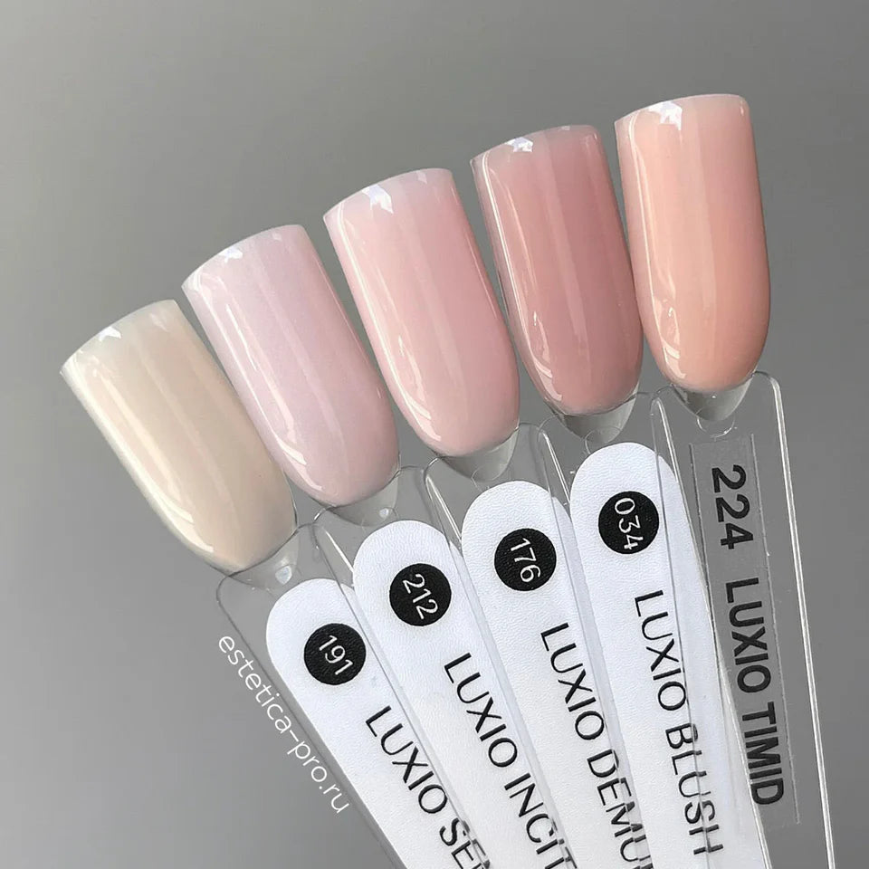 Luxio Soak-Off Gel Polish Demure sheer 15ml bottle, with a clear, glossy finish and elegant packaging.