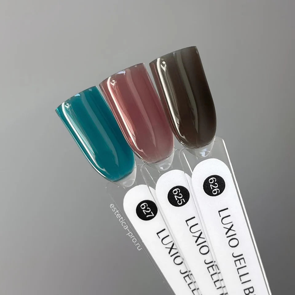 Luxio Soak-Off Gel Polish Jelli Teal 15ml bottle with colorful gel polish inside and applicator brush visible.