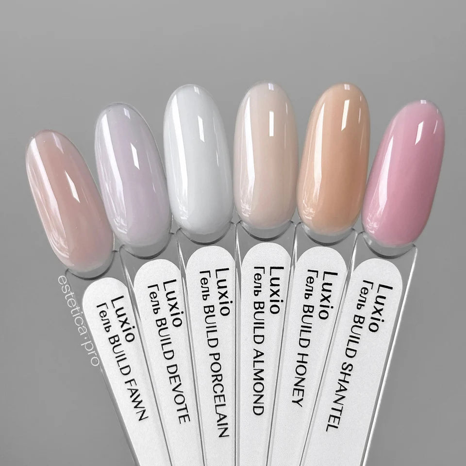 Luxio UV/LED soak-off build gel in tinted honey shade, 15ml bottle, used for durable nail enhancements.
