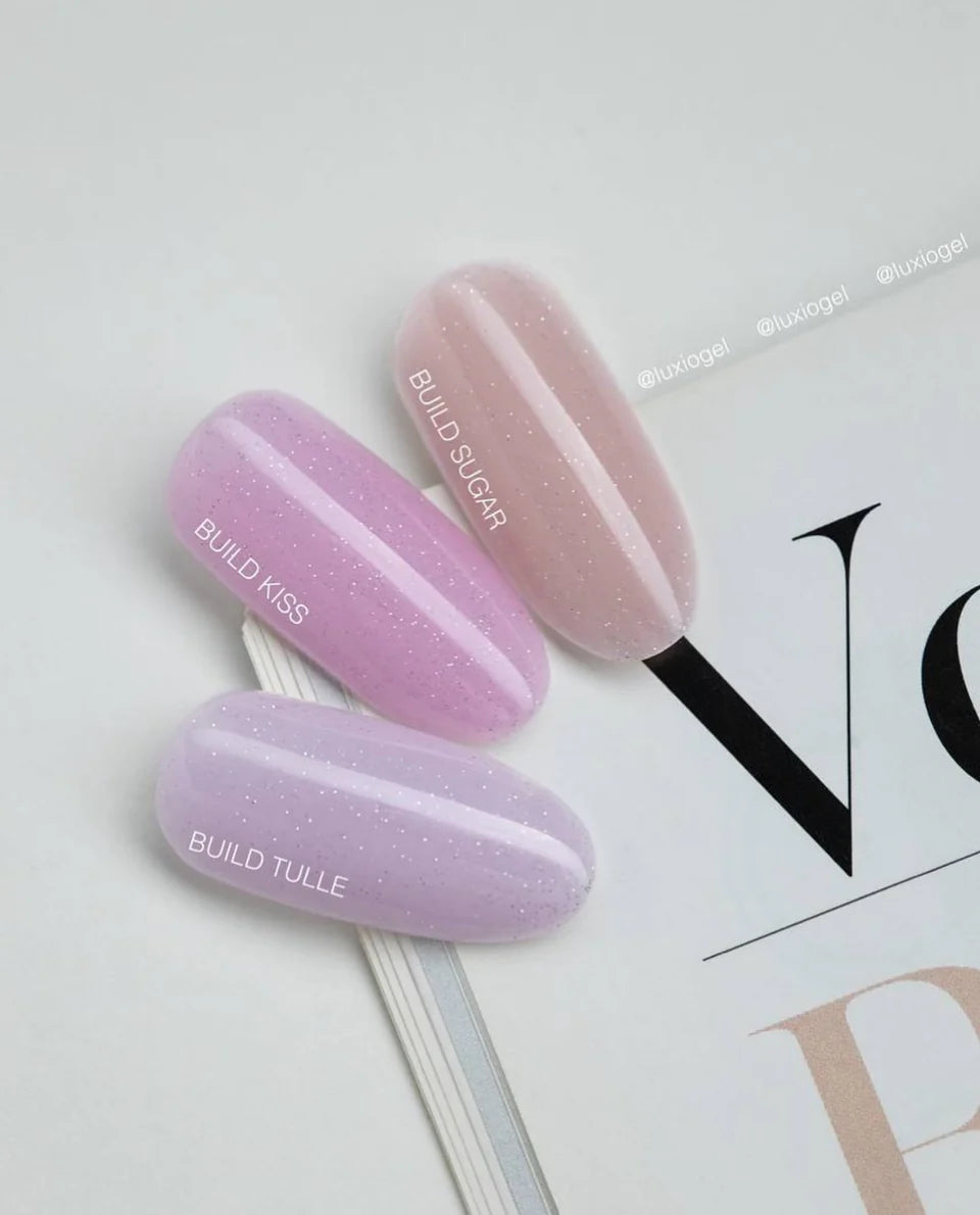 Luxio UV/LED soak off build nail gel with sparkles in 15ml bottle, featuring tulle texture and shiny finish for nail art.