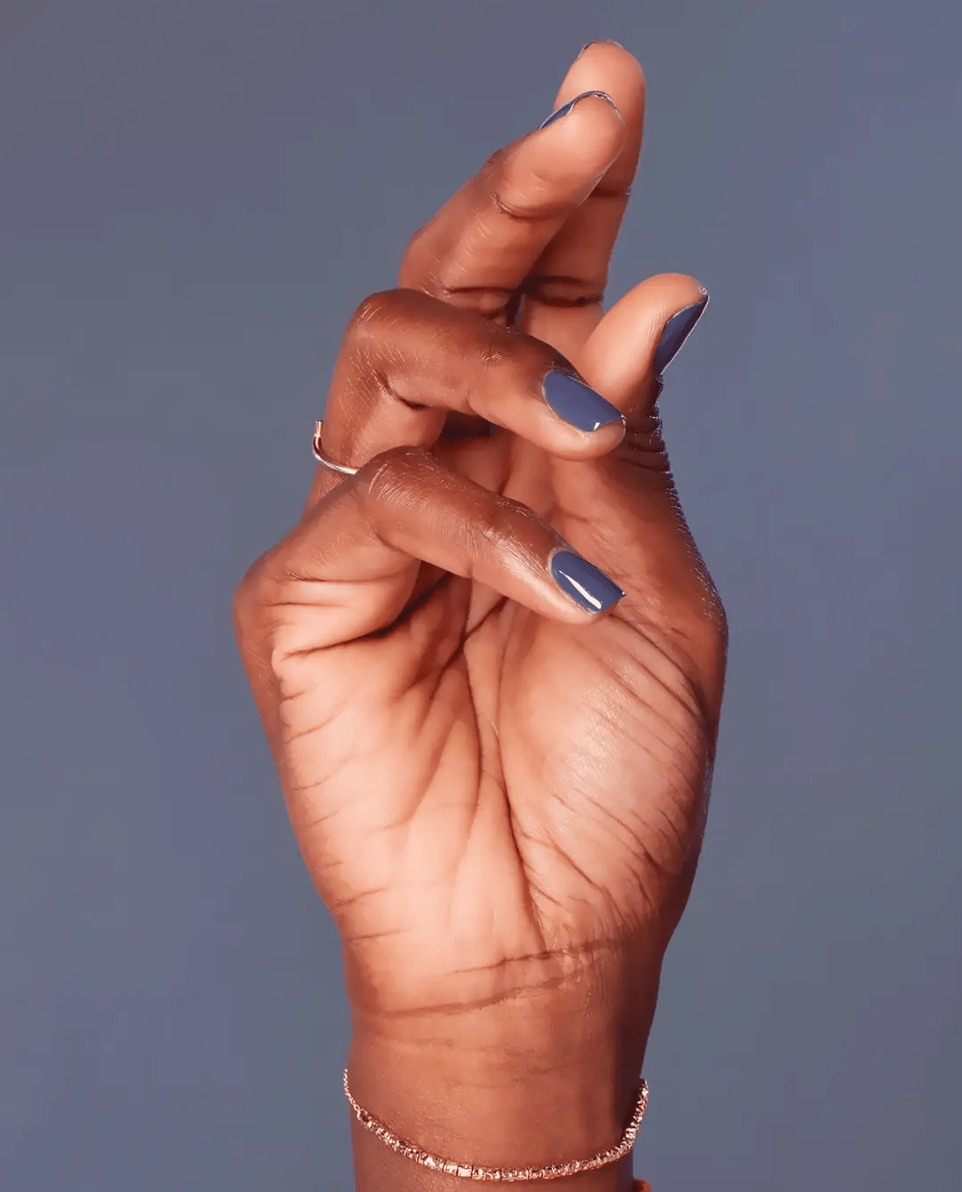 OPI Nail Polish Less is Norse #I59 in a dark, rich gray shade, shown in a close-up image of the bottle with a smooth finish.
