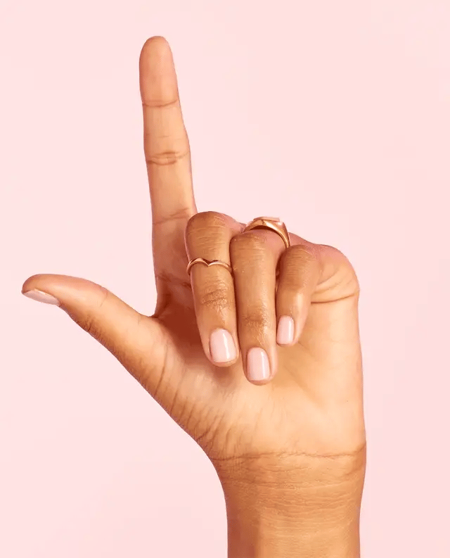OPI Powder Perfection Love Is In The Bare powder nail color in a soft, nude beige shade with a smooth, matte finish.