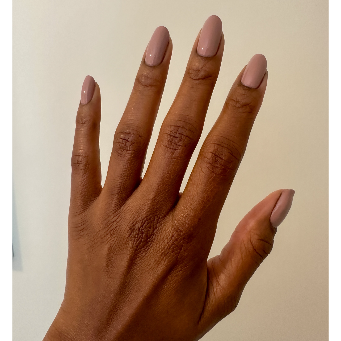Orly Nail Lacquer in In The Conservatory, clear glass bottle with black cap, showcasing the nail polish color and branding.