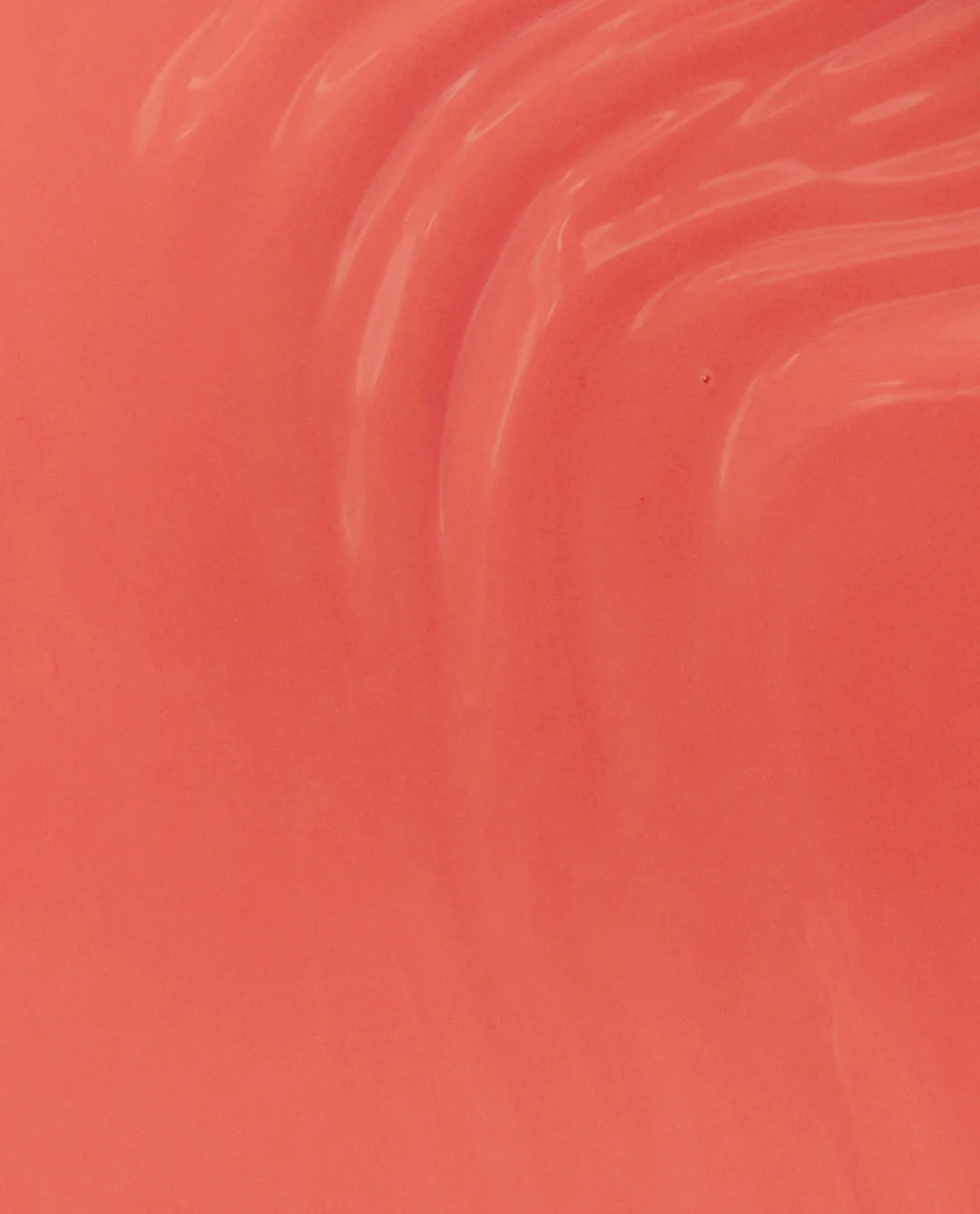 OPI Nail Polish in My Chihuahua Doesn't Bite Anymore #M89, featuring a swatch of the coral-colored nail polish on a brush.