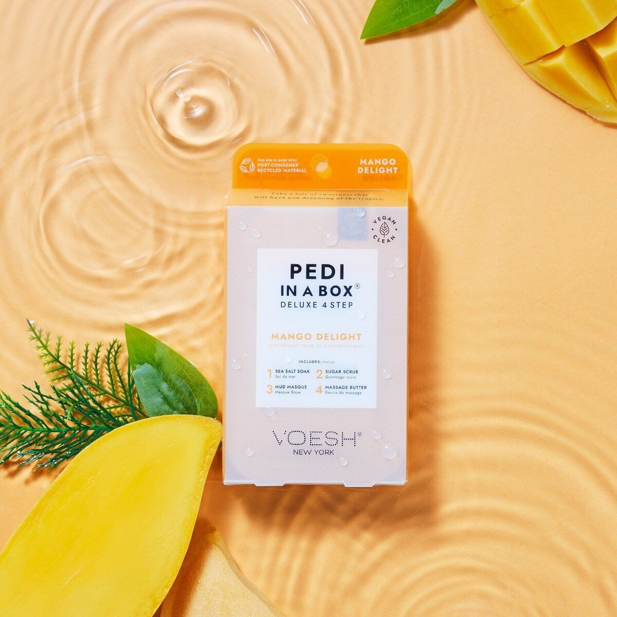 Voesh Pedi In A Box Mango Delight 4 Step set with foot care products and mango scent for a professional pedicure at home.