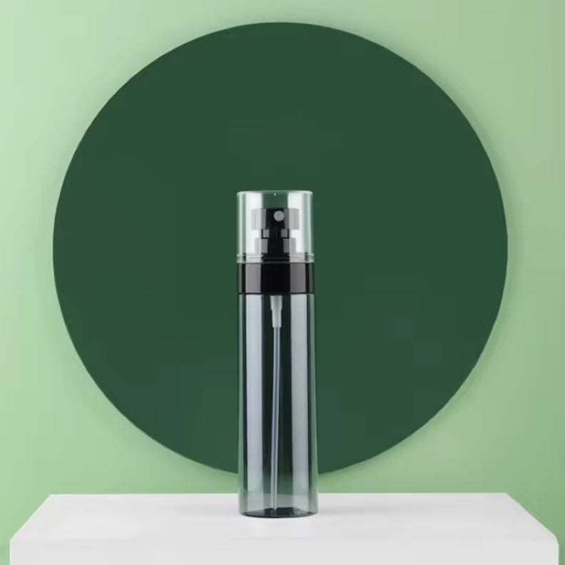 Refillable 120mL UNS Mist Spray Bottle for nail tools, clear plastic with a black spray nozzle, used for nail prep and finishing.