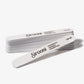 Set of 25 white Sirooni nail files with 100/180 grit, rounded edges, used for shaping and smoothing nails in professional nail care.