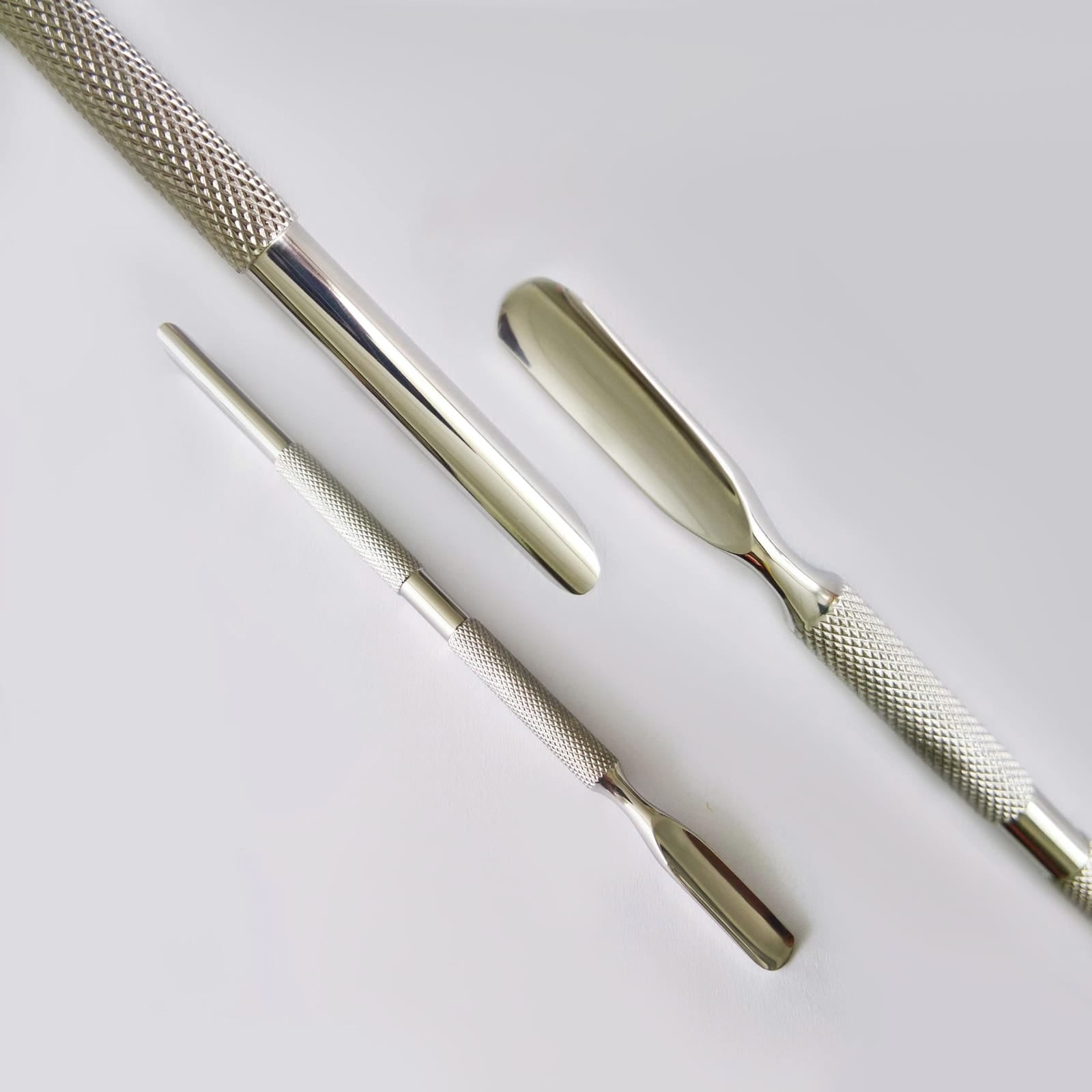 AAA Russian-Style Double-Headed Horseshoe Steel Pusher from UNS, stainless steel nail tool with dual heads for horseshoe shaping and nails.