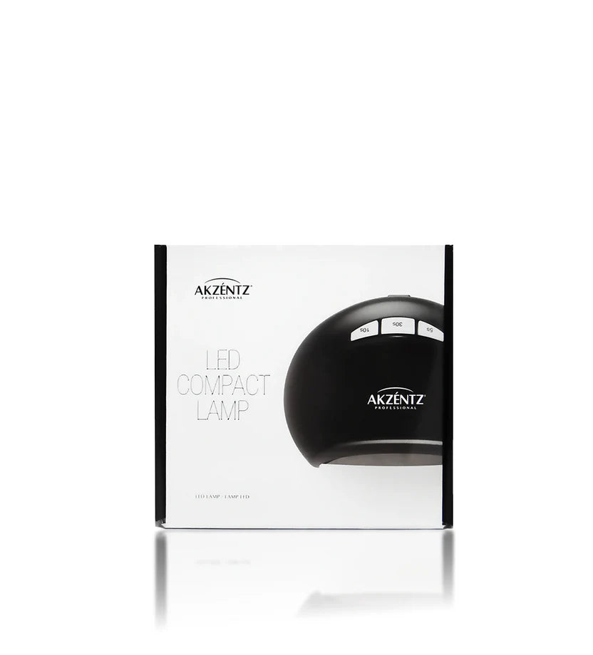 Akzentz Compact LED nail lamp curing Luxio gel polish, featuring a sleek design and LED light for professional nail drying.
