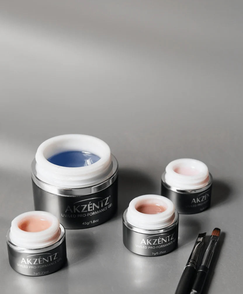 Luxio Akzéntz Pro-Formance Balance Coverage Warm Pink acrylic nails with TPO-free hard gel, showcasing a natural pink finish and smooth surface.