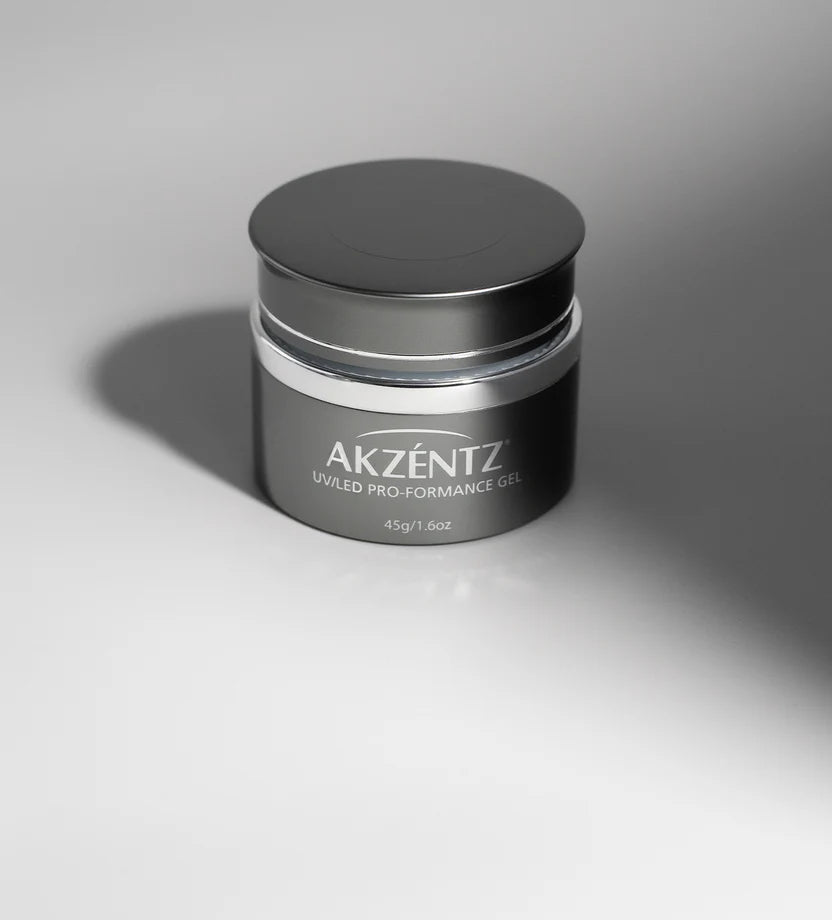 Luxio Akzéntz Pro-Formance white acrylic nail tips in a jar, TPO free, for professional nail enhancements and styling.