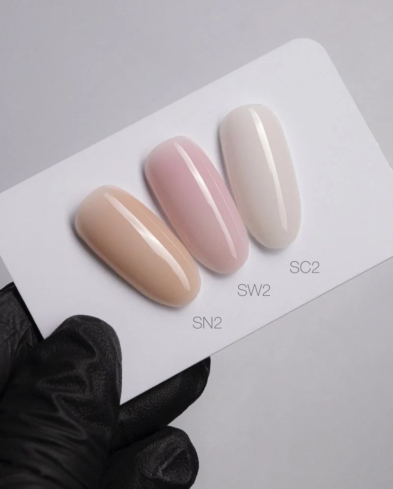 Luxio Akzéntz Pro Formance Trinity Shade SW2 UV/LED soak-off gel nail polish in a small jar with a black lid and label.