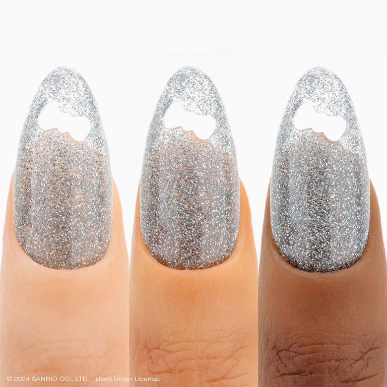 Aprés Nail Aprés Gel Color Polish in Hello Kitty Flash Glitter with vibrant, sparkly pink and glitter accents on a nail display.