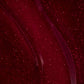 Aprés Nail Aprés Gel Color Polish Ruby Slippers 251 bottle with red gel polish and brush cap, close-up of product packaging.