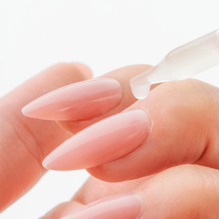 Aprés Nail Cuticle Oil Gel System with Coconut, Sage, and Jasmine for nourishing cuticles, shown in a sleek gel bottle.