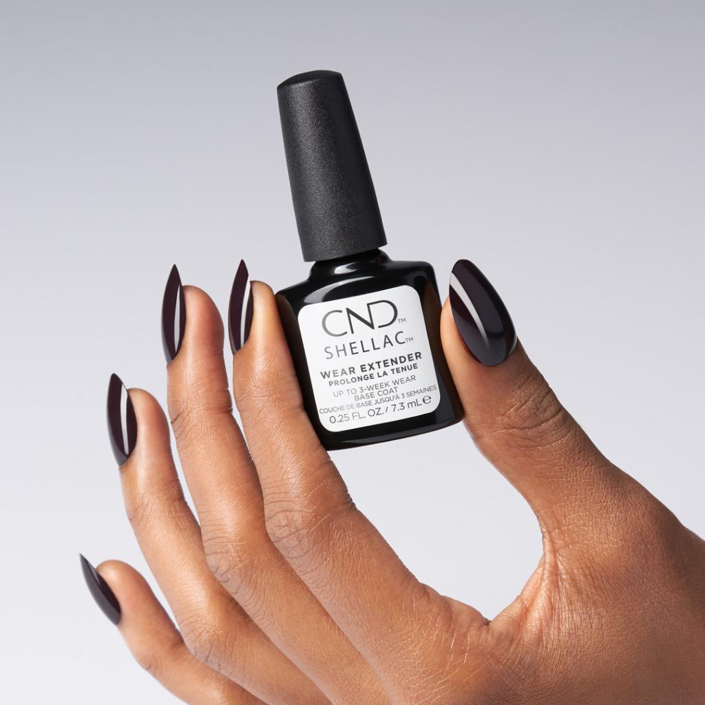 Creative Nail Design Shellac Wear Extender Base Coat in 0.25 oz, gel nail polish base coat bottle with label and applicator brush.