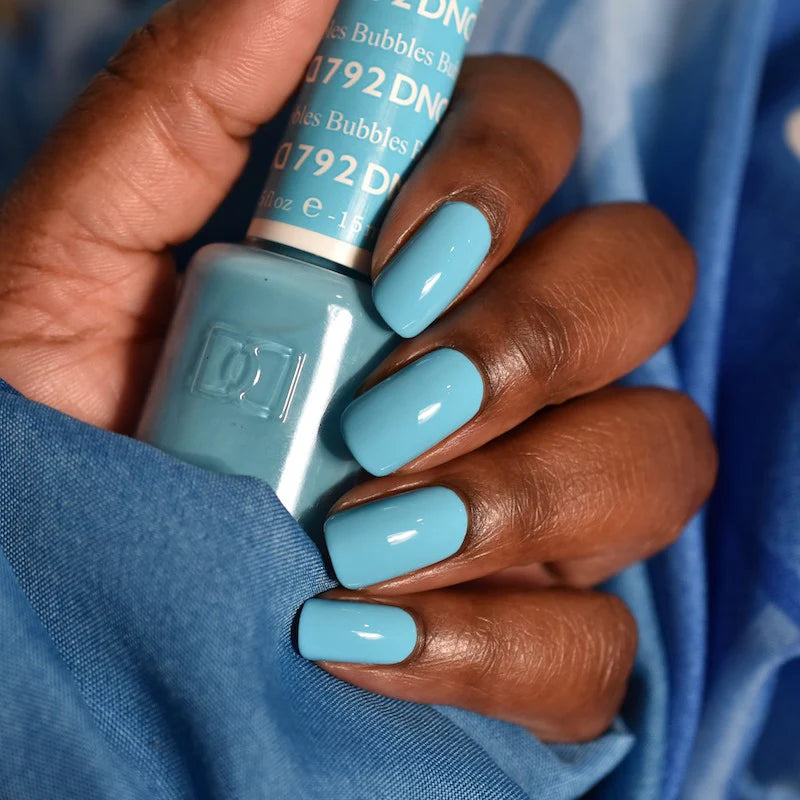 DND Daisy Gel Duo Bubbles #792 with vibrant gel nail polish and lacquer bottles in colorful packaging on a white background