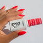 Swatch of DND Daisy Gel Duo in Red #563, featuring a vibrant gel nail polish and lacquer finish.