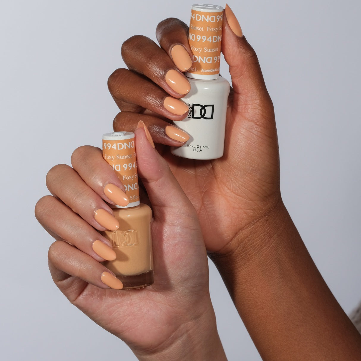 DND Daisy Gel Duo Foxy Sunset #994 featuring vibrant orange and yellow gel nail polish and lacquer in a sleek bottle