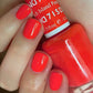Swatch of DND Daisy Gel Duo Island Punch #715 featuring vibrant gel nail polish and lacquer in a bright, tropical pink shade.
