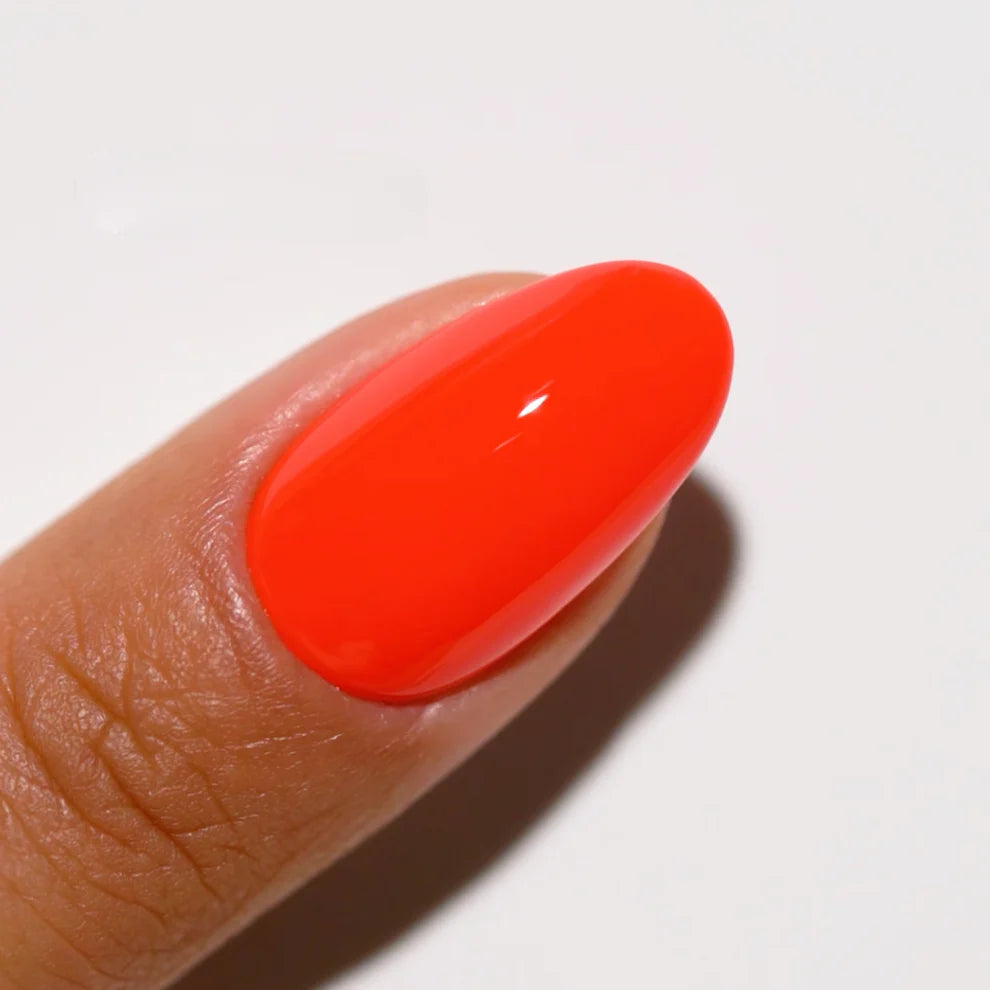 DND Daisy Gel Duo Island Punch #715 gel nail polish and lacquer swatch showing vibrant coral pink color on nails