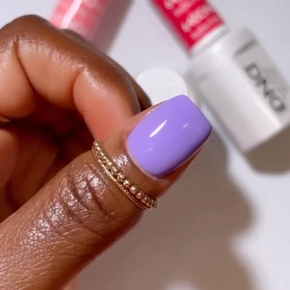 DND Daisy Gel Duo in Kazoo Purple #662 featuring a vibrant purple gel nail polish and lacquer finish on a nail display