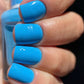 DND Daisy Gel Duo Midnight Kiss #672 with gel nail polish and lacquer bottles in a sleek black and pink design.