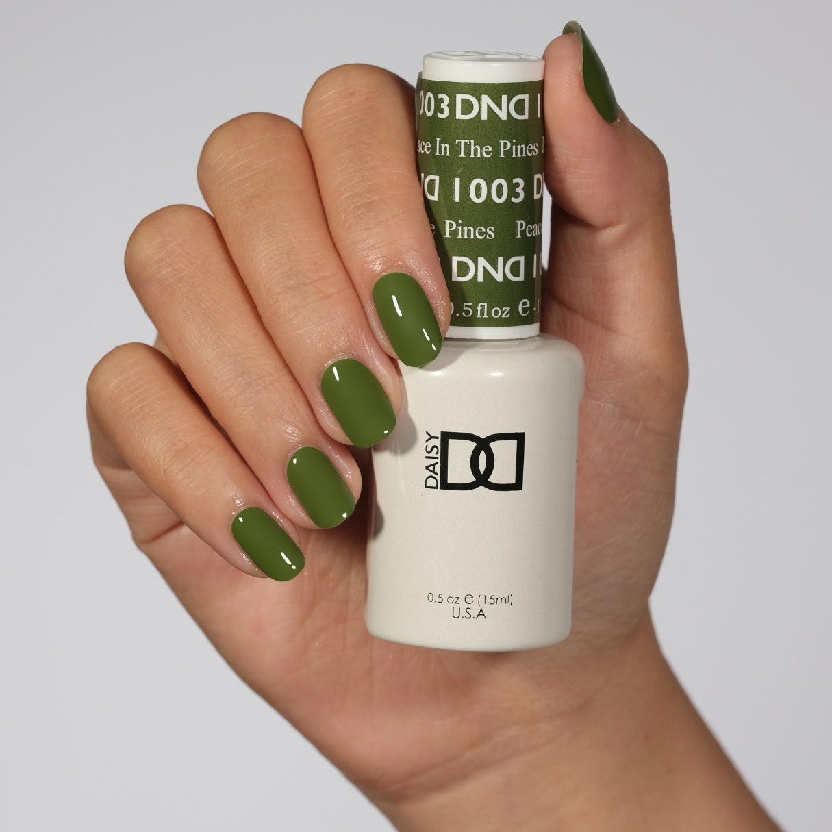 DND Daisy Gel Duo Peace in the Pines #1003 featuring a vibrant gel nail polish and lacquer in a botanical-inspired shade.