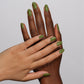 DND Daisy Gel Duo Peace in the Pines nail polish and lacquer set with pastel green and floral design on the bottles.