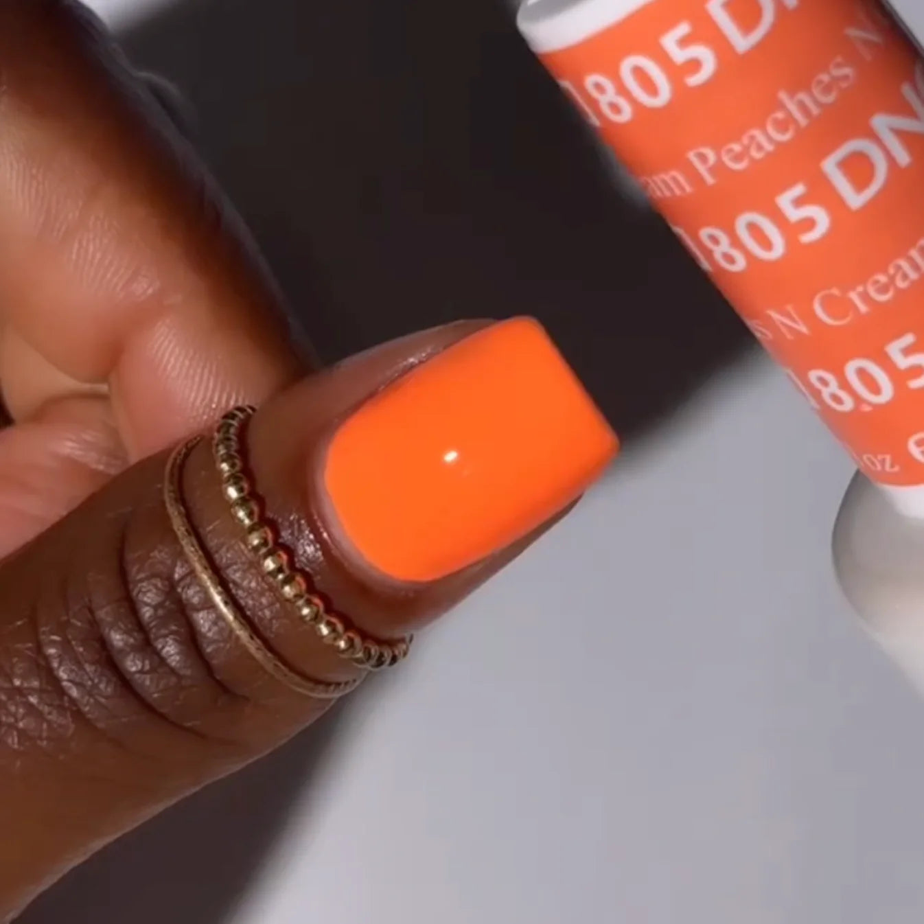 DND Daisy Gel Duo Peaches n Cream #805 featuring a glossy peachy gel nail polish and lacquer.
