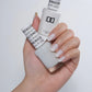 Swatch of DND Daisy Gel Duo Pearly Ice #862 gel nail polish and lacquer in a shiny, pearly white shade.