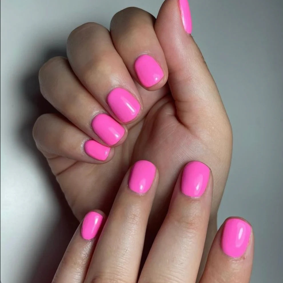 Swatch of DND Daisy Gel Duo Pinky Promise #644 with pink gel nail polish and lacquer finish, showcasing vibrant, glossy color.