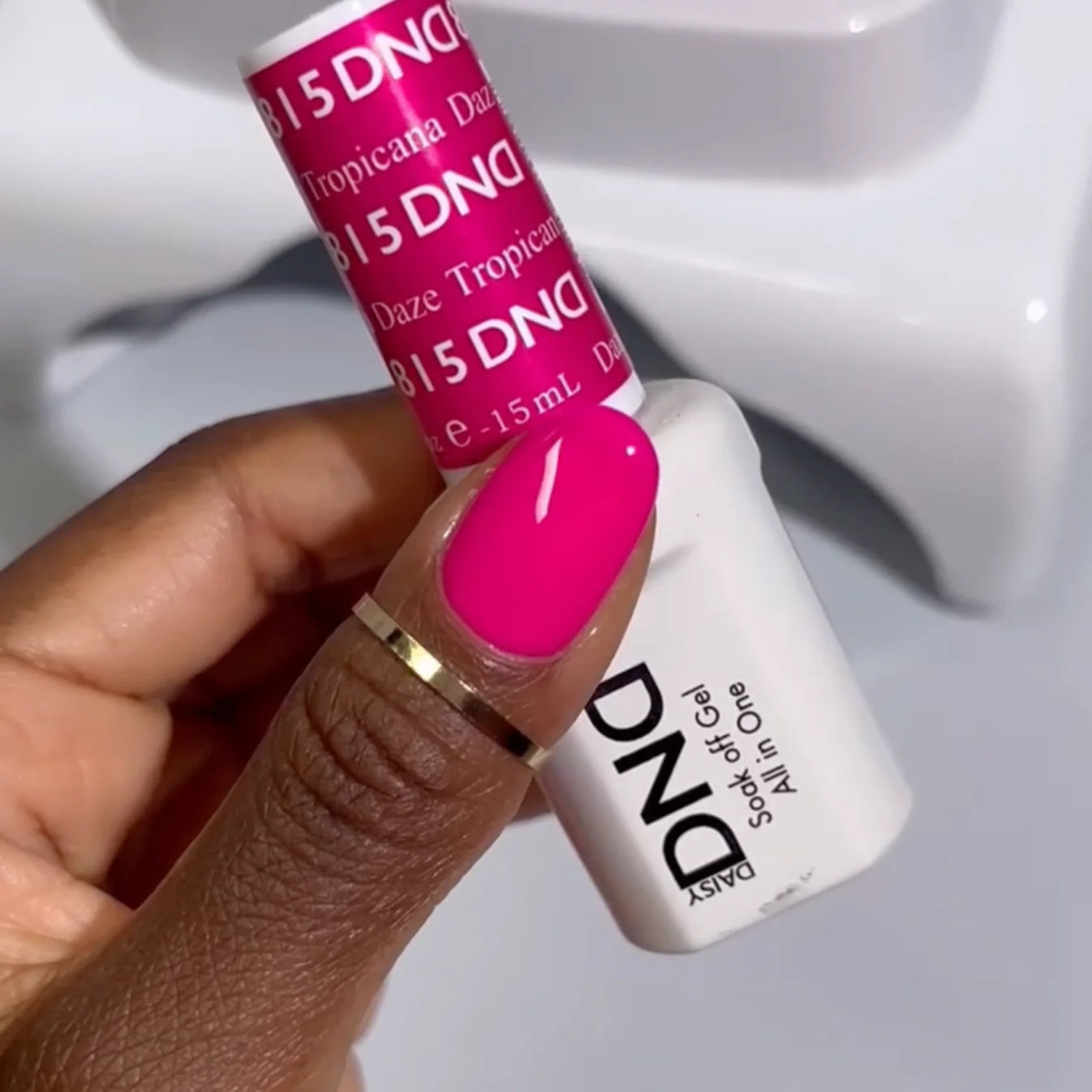 DND Daisy Gel Duo Tropicana Daze #815 gel nail polish and lacquer swatch showing vibrant, tropical-inspired bright orange color.