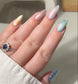 DND DC Gel Polish in Aqua Freckles #19 with vibrant aqua and multicolored speckled design, perfect for cat eye nail art.