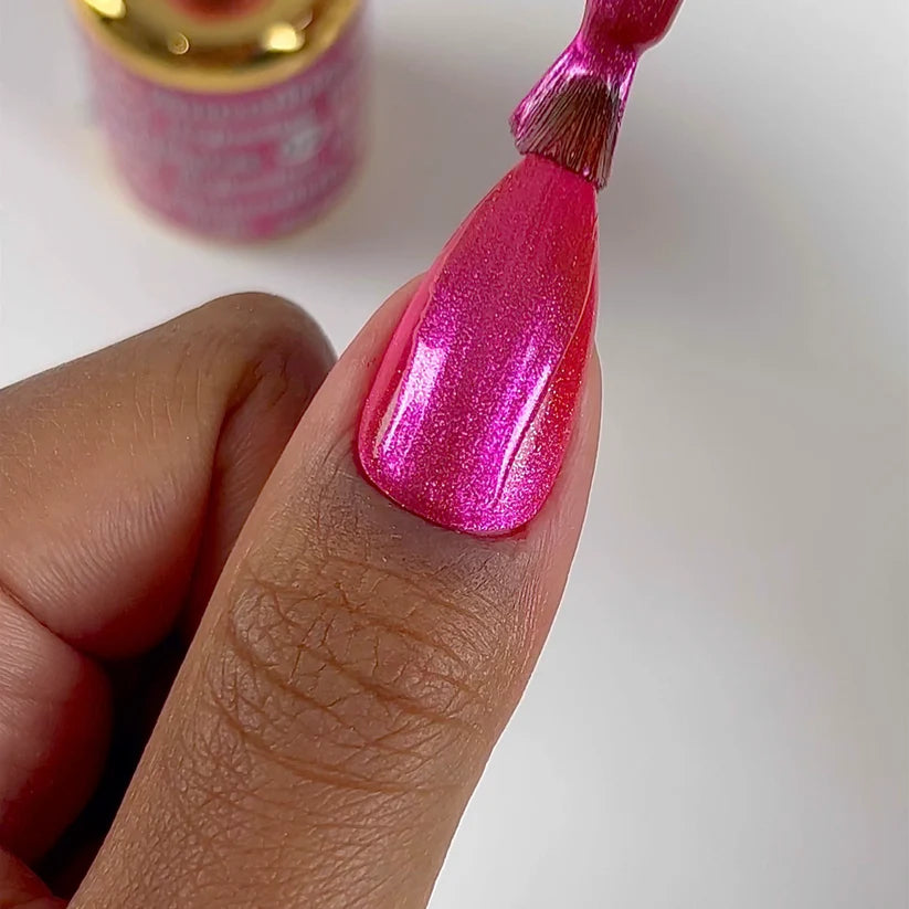 DND DC Gel Polish in Bejeweled #02 featuring a vibrant cat eye and jeweled finish with shimmering blue and silver accents.