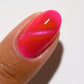 DND DC Gel Polish Bejeweled #02 featuring a vibrant cat eye design with shimmering bejeweled accents on a black base.
