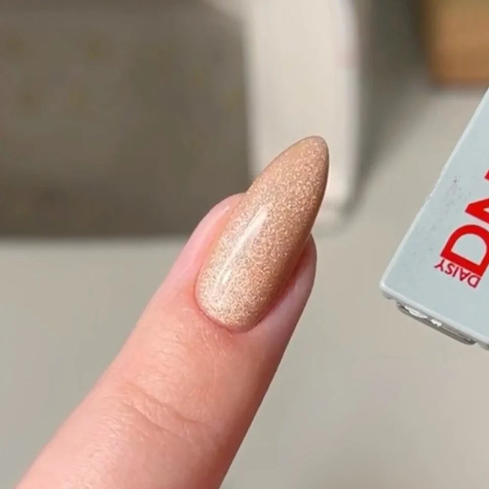 DND DC Gel Polish Caramel Lullaby #28 swatch showing velvet cat eye shimmer and caramel color on nails.