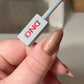 DND DC Gel Polish Cat Eye shade #35 with brown coffee shimmer, showcasing a cat eye effect on nail swatch.
