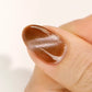 DND DC Gel Polish Cat Wink #35 with velvet caramel brown shade featuring shimmer and cat eye effect on manicured nails