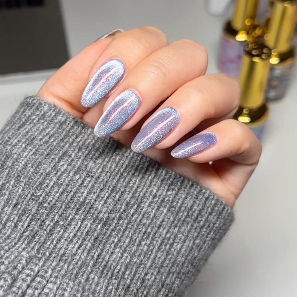 DND DC Gel Polish in Celestial Prism shade, showcasing a vibrant cat eye effect with shimmering cosmic colors.