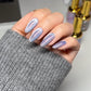 DND DC Gel Polish in Celestial Prism shade, showcasing a vibrant cat eye effect with shimmering cosmic colors.