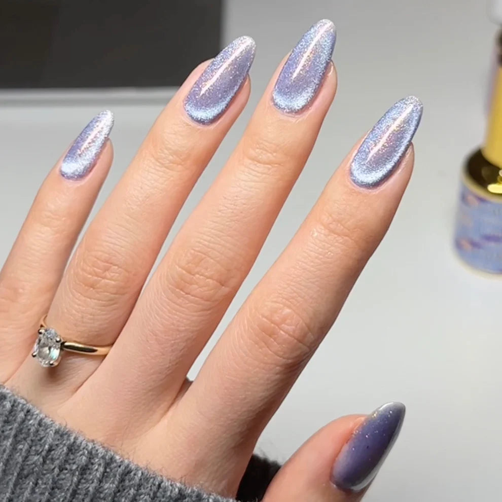 DND DC Gel Polish Cat Eye in Celestial Prism shade, showcasing iridescent purple and blue gel with a cat eye effect.